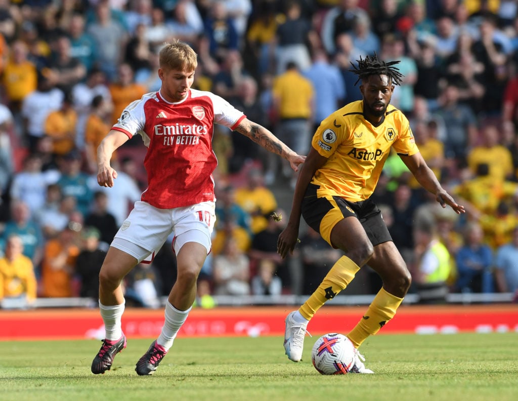 Emile Smith Rowe of Arsenal is challenged by Boubacar Traore of Wolves during the Premier League match between Arsenal FC and Wolverhampton Wandere...