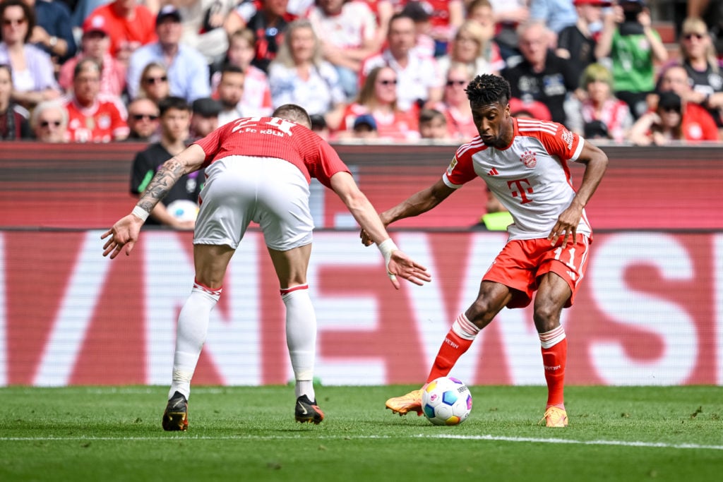 Jeff Chabot of 1.FC Koeln and Kingsley Coman of Bayern Muenchen battle for the ball during the Bundesliga match between FC Bayern München and 1. FC...