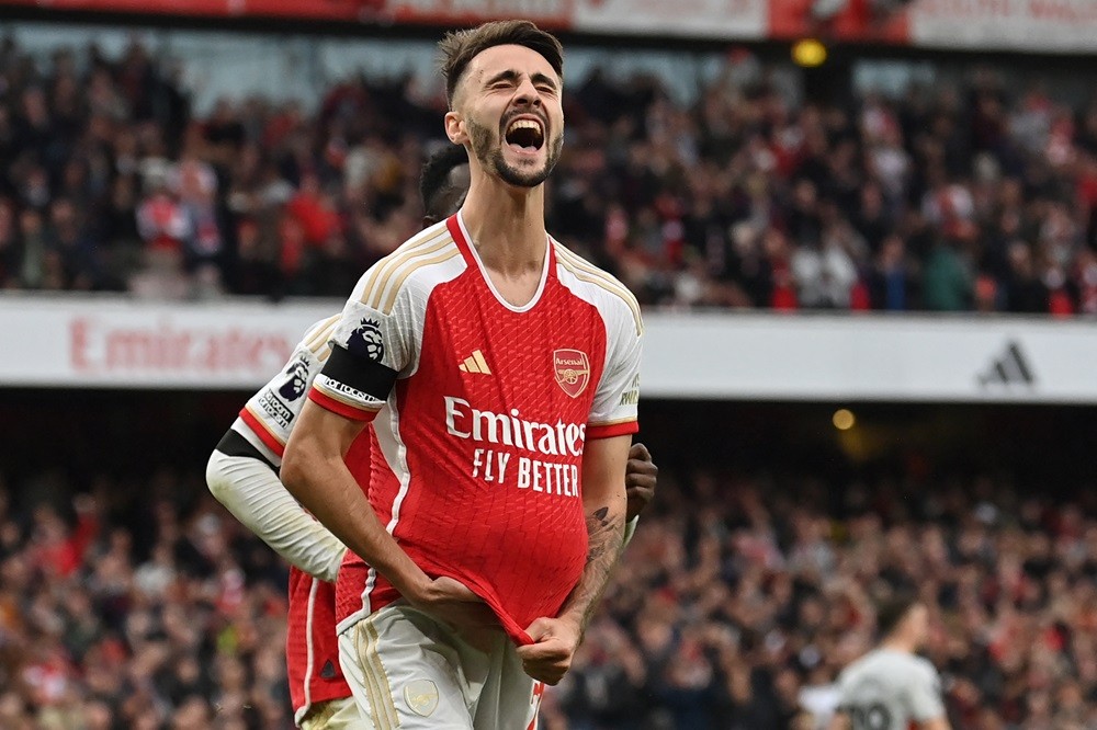 Arsenal's Fabio Vieira celebrates after scoring their fourth goal from the penalty spot during the English Premier League football match between Arsenal and Sheffield United at the Emirates Stadium in London on October 28, 2023. (Photo by GLYN KIRK/AFP via Getty Images)