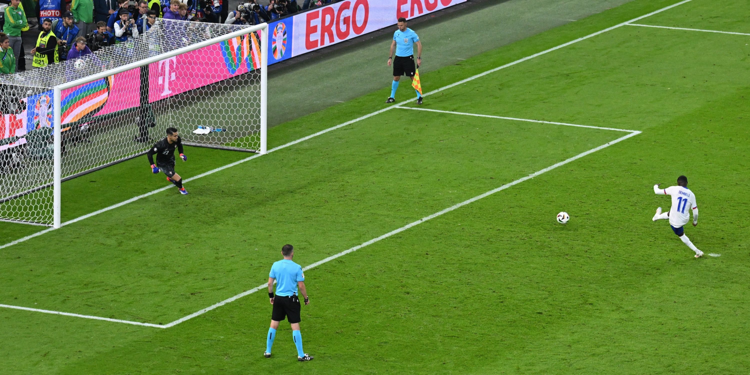 France's Ousmane Dembele scores a penalty during the penalty shootout past Portugal's Diogo Costa